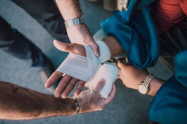 Peron's hand being bandaged